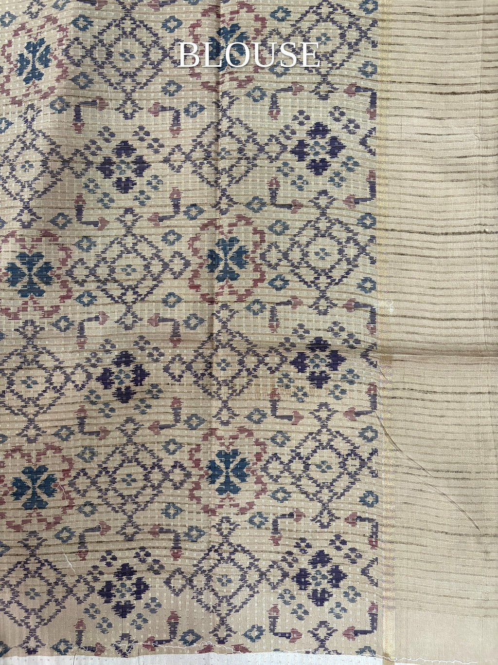 Beige blouse piece with blue and pink geometric motifs
