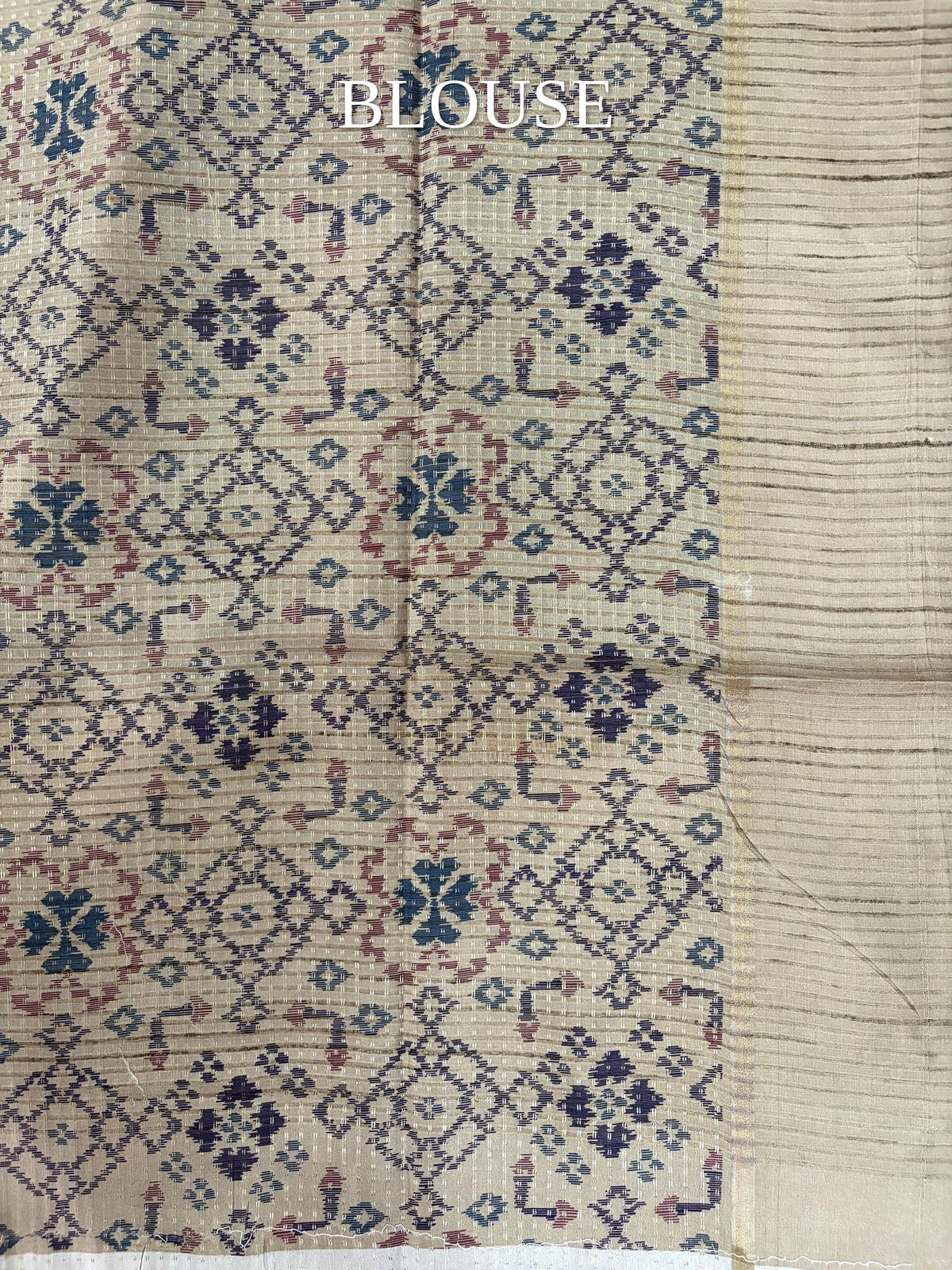 Beige blouse piece with blue and pink geometric motifs